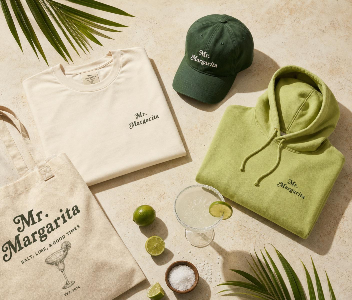 Mr. Margarita premium apparel flatlay with lime, salt and margarita
